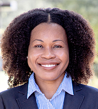 Close-up of a woman wearing a blue suit.